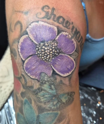 Purple floral colour tattoo