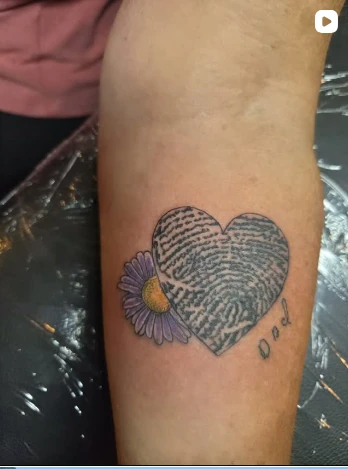 Colour heart tattoo with a flower